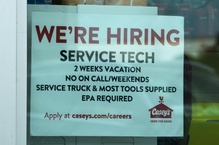 A hiring sign is displayed at a gas station in Vernon Hills, Ill., Monday, June 3, 2024. On Thursday, June 13, 2024, the Labor Department reports on the number of people who applied for unemployment benefits last week. (AP Photo/Nam Y. Huh)