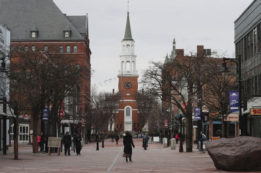 Pedestrians walk down Church Street in Burlington, Vt., on March 11, 2020. In 2023, Vermont's largest city voted to allow noncitizens who are in the country legally to vote in local elections. (AP Photo/Charles Krupa) **FILE**