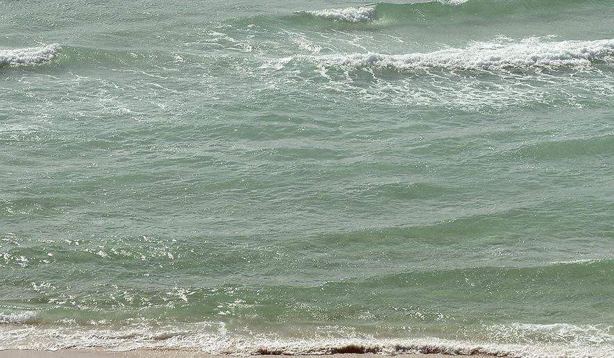 Waves approach the shore in Panama City Beach, Fla., on Tuesday, Jan. 10, 2017. On Saturday, June 22, 2024, authorities said three Alabama men have died from likely drowning after becoming distressed while swimming at a Florida Panhandle beach. (Andrew Wardlow/News Herald via AP, File)