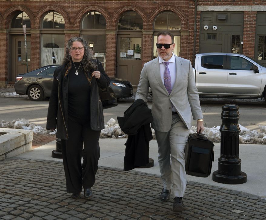 Dr. Merideth Norris walks into federal court in Portland, Maine, with her attorney Tim Zerillo on Wednesday, Feb. 7, 2024. Norris, 53, of Kennebunk, was found guilty Friday, June 21, of distributing the opioids at her practice without a legitimate medical purpose and did so knowing that some patients were battling opioid addiction. A federal jury convicted Norris on 15 counts of distributing controlled substances and she faces up to 20 years on each count. (Gregory Rec/Portland Press Herald via AP)