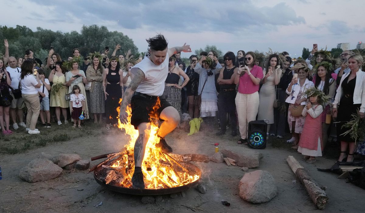 NextImg:Ukrainians in Warsaw jump over a bonfire, float braids to celebrate solstice custom away from home