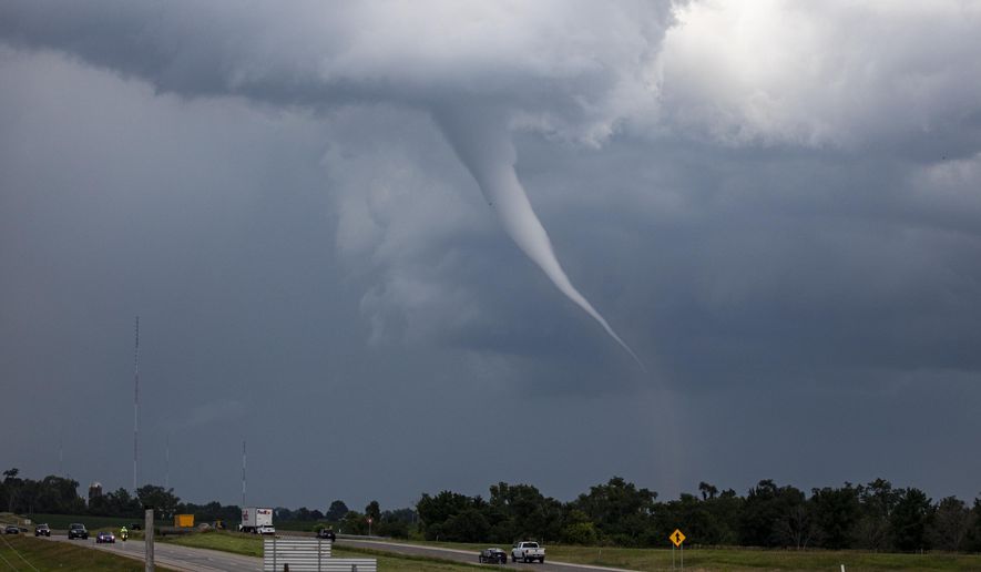 A tornado is seen near Cedar Rapids, Iowa on Tuesday, June 25, 2024. More severe weather was forecast to move into the region Tuesday, potentially bringing large hail, damaging winds and even a brief tornado or two in parts of western Iowa and eastern Nebraska, according to the National Weather Service. (Nick Rohlman/The Gazette via AP)