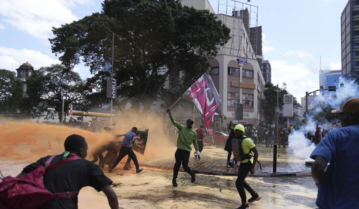 NextImg:Part of Kenya’s Parliament is on fire as thousands of protesters enter
