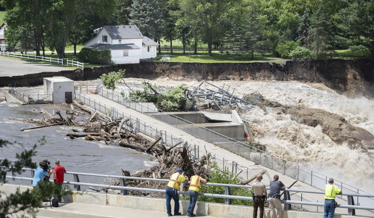NextImg:WATCH: House collapses into Minnesota river as flooding and extreme weather grip the Midwest