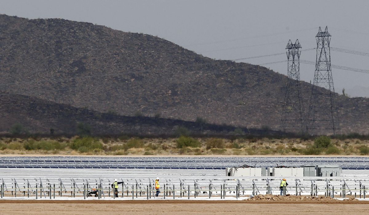 NextImg:A signature Biden law aimed to boost renewable energy. It also helped a solar company reap billions