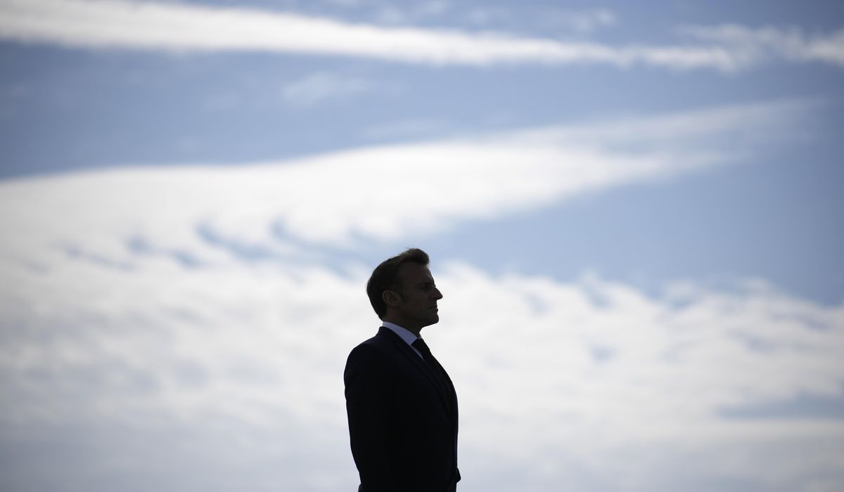 NextImg:Macron weakened at home and abroad as an early French election gives the far right momentum