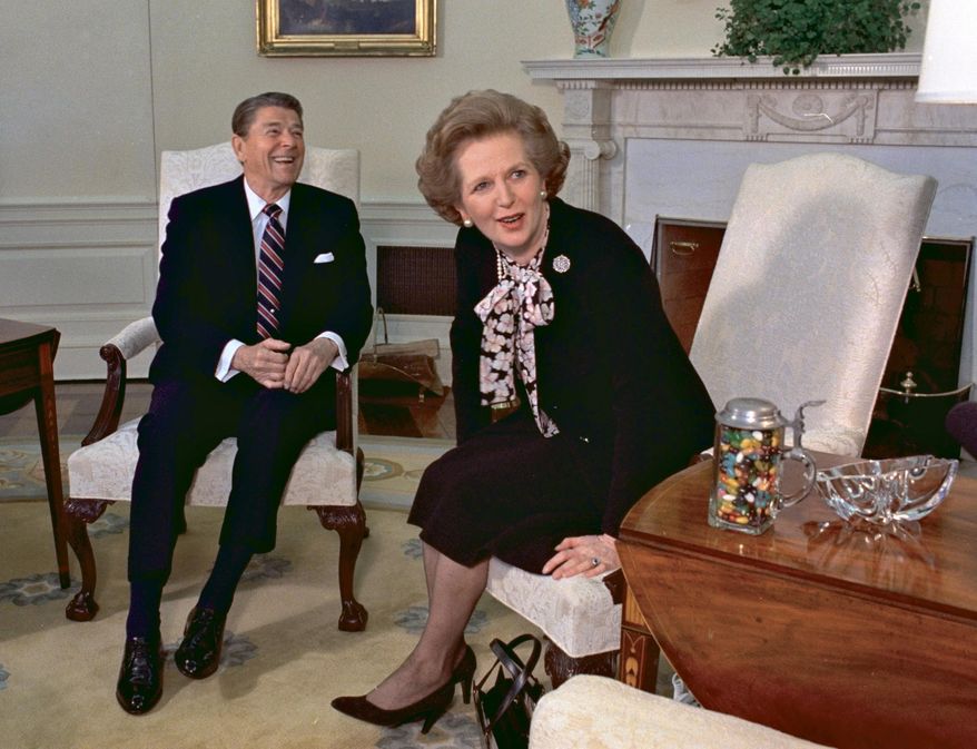 FILE - British Prime Minister Margaret Thatcher meets with US President Ronald Reagan at the White House in Washington, Feb. 20, 1985. Britain’s upcoming general election on July 4, 2024, is widely expected to lead to a change of government for the first time in 14 years. Britain's general election in 1979 is without doubt the most consequential since 1945, with Margaret Thatcher becoming the country’s first female prime minister on a radical Conservative economic agenda. At its heart, Thatcherism represented a total rethink over the role of the state. (AP Photo/J. Scott Applewhite, File)