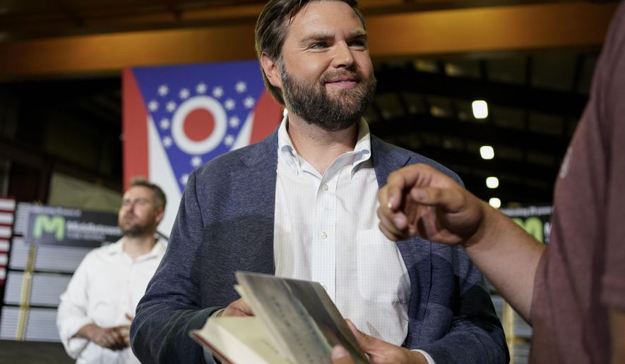 J.D. Vance, the venture capitalist and author of "Hillbilly Elegy," holds his book as he speaks with supporters after a rally on July 1, 2021, in Middletown, Ohio, where he announced he is joining the crowded Republican race for the Ohio U.S. Senate seat. (AP Photo/Jeff Dean) **FILE**