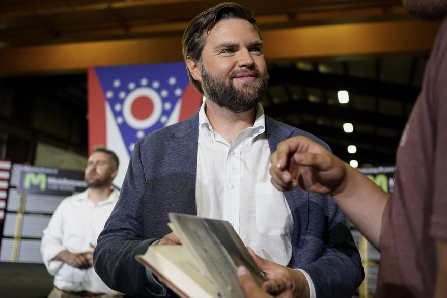 J.D. Vance, the venture capitalist and author of "Hillbilly Elegy," holds his book as he speaks with supporters after a rally on July 1, 2021, in Middletown, Ohio, where he announced he is joining the crowded Republican race for the Ohio U.S. Senate seat. (AP Photo/Jeff Dean) **FILE**