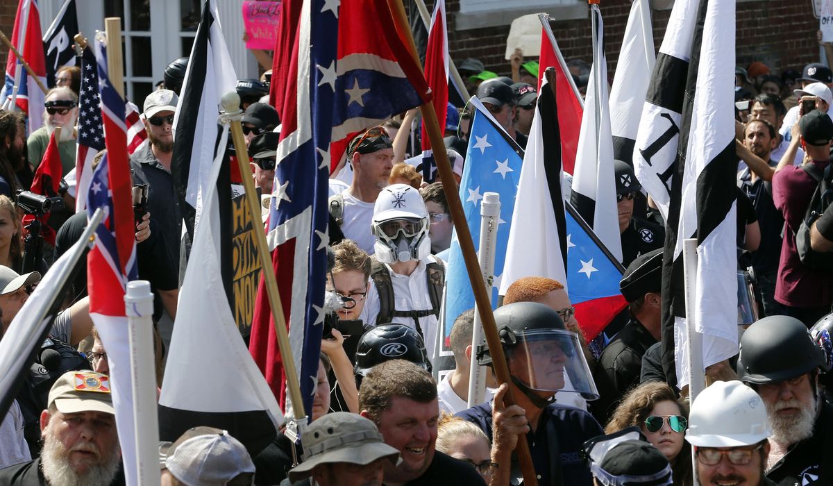 NextImg:Tiki torch ‘tribute’ to Charlottesville rally participants joins poop statue as pop-up monuments