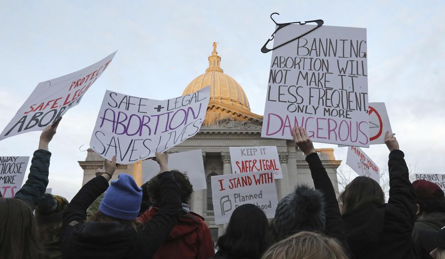 Demonstrators protest outside the Wisconsin Capitol, May 3, 2022, in Madison, Wis. The Wisconsin Supreme Court decided Monday, July 1, 2024, to consider two challenges to a 175-year-old law that conservatives maintain bans abortion without letting the cases wind through lower courts. (Amber Arnold/Wisconsin State Journal via AP, File)