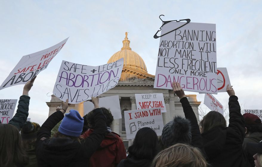 Demonstrators protest outside the Wisconsin Capitol, May 3, 2022, in Madison, Wis. The Wisconsin Supreme Court decided Monday, July 1, 2024, to consider two challenges to a 175-year-old law that conservatives maintain bans abortion without letting the cases wind through lower courts. (Amber Arnold/Wisconsin State Journal via AP, File)