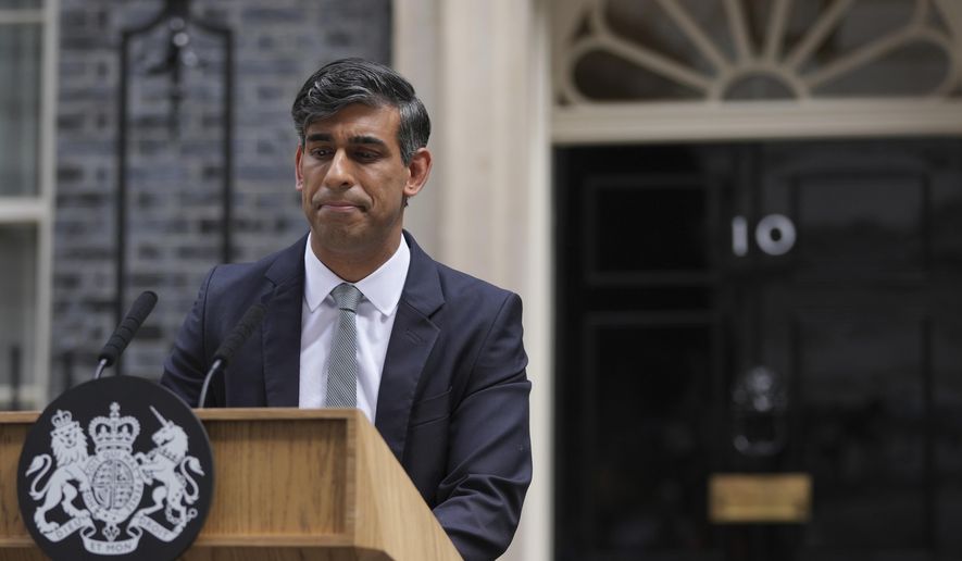 Britain's outgoing Conservative Party Prime Minister Rishi Sunak looks down as he makes a short speech outside 10 Downing Street before going to see King Charles III to tender his resignation in London, Friday, July 5, 2024. Sunak and his Conservative Party lost the general election held July 4, to the Labour Party, whose leader Keir Starmer is set become Prime Minister later Friday. (AP Photo/Kin Cheung)