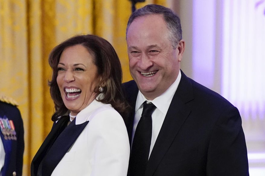 Vice President Kamala Harris, left, and second gentleman Doug Emhoff arrive in the East Room of the White House, Feb. 11, 2023, in Washington. Emhoff has tested positive for COVID-19 after experiencing mild symptoms, his office announced Sunday, July 7, 2024, but Harris, has tested negative and remains asymptomatic. (AP Photo/Manuel Balce Ceneta, File)