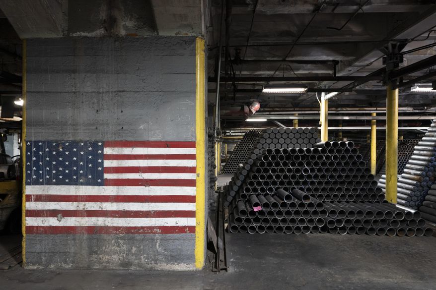 155 mm M795 artillery projectiles are stacked during the manufacturing process at the Scranton Army Ammunition Plant in Scranton, Pa., Thursday, April 13, 2023. The 155 mm howitzer round is one of the most requested military aid artillery munitions of the Ukraine war. (AP Photo/Matt Rourke, File)