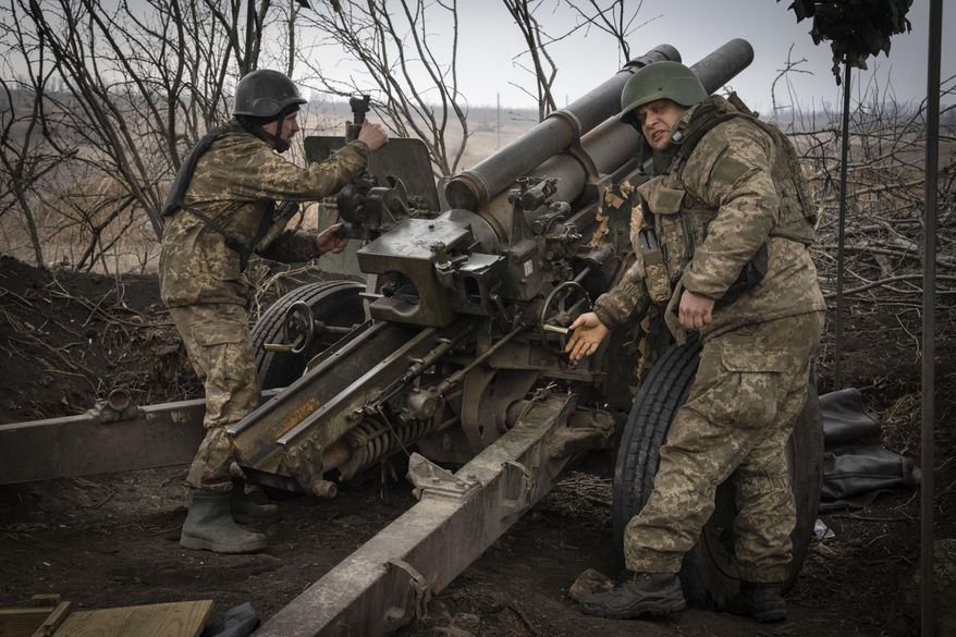 Ukrainian soldiers of the 71st Jaeger Brigade fire a M101 howitzer toward Russian positions at the frontline, near Avdiivka, Donetsk region, Ukraine, Friday, March 22, 2024. (AP Photo/Efrem Lukatsky, File)