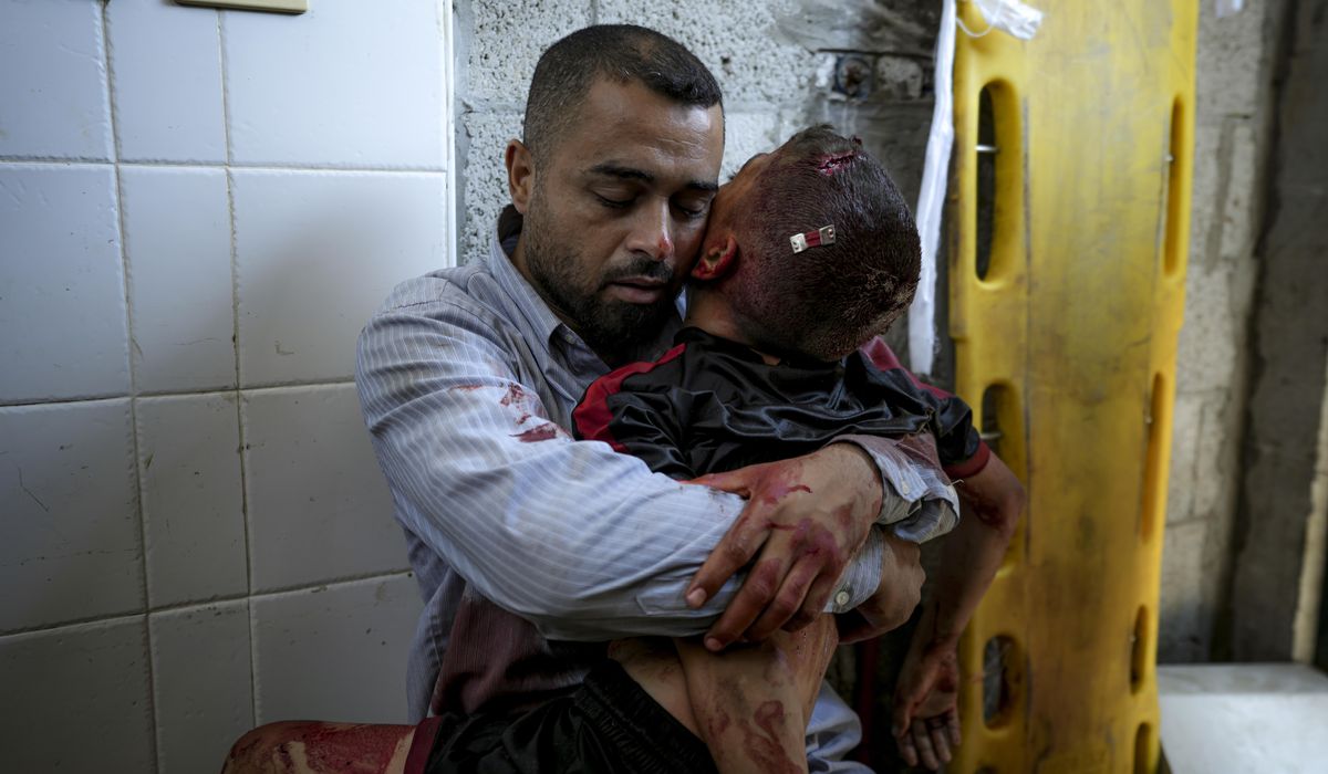 NextImg:A boy in Gaza was killed by an Israeli airstrike. His father held him and wouldn’t let go