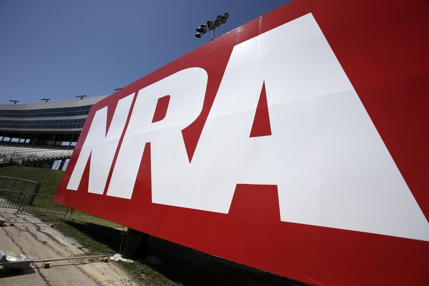 An NRA sign is seen outside the track of the NASCAR Sprint Cup series in Fort Worth, Texas, on April 12, 2013. (AP Photo/Tim Sharp) **FILE**
