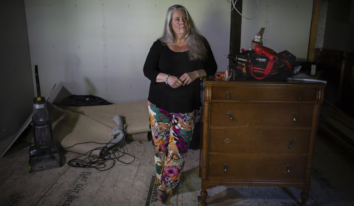 NextImg:Their Vermont homes were inundated by extreme flooding. A year later, they still struggle to recover