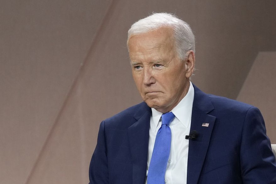 President Joe Biden listens during a meeting with Ukraine's President Volodymyr Zelenskyy on the sidelines of the NATO Summit in Washington, Thursday, July 11, 2024. (AP Photo/Susan Walsh)