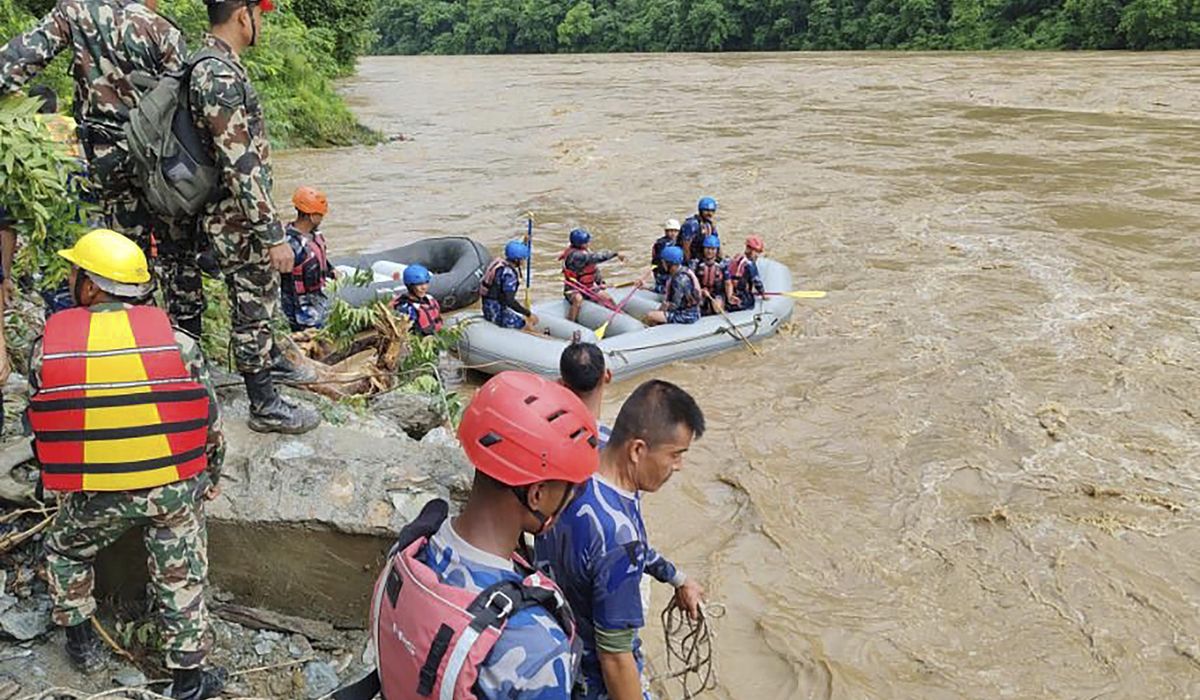 NextImg:2 buses carrying more than 50 people were swept into a river by a landslide in Nepal