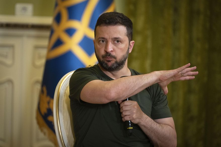 Ukrainian President Volodymyr Zelenskyy gestures during a press conference in Kyiv, Ukraine, Monday, July 15, 2024. (AP Photo/Efrem Lukatsky)