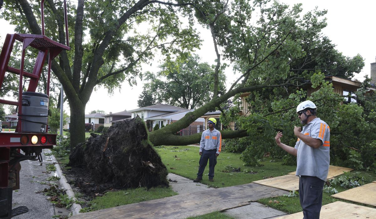 NextImg:A dam fails after rain, wind, tornadoes pound the Midwest. The Chicago area is cleaning up