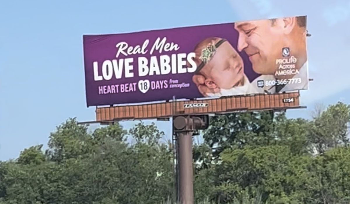 NextImg:Battling billboards welcome conventioneers to Milwaukee