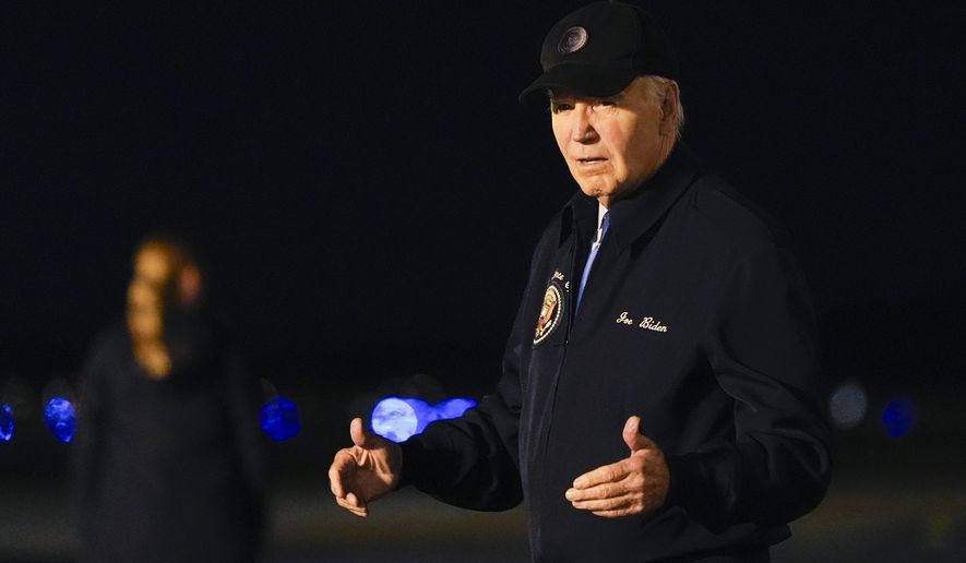 President Joe Biden walks to his car after stepping off of Air Force One at Dover Air Force Base in Delaware, Wednesday, July 17, 2024. Biden is returning to his home in Rehoboth Beach, Del., to self-isolate after testing positive for COVID-19. (AP Photo/Susan Walsh)