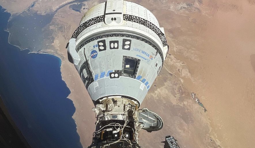 This photo provided by NASA shows the Starliner spacecraft docked to the Harmony module of the International Space Station, orbiting 262 miles above Egypt's Mediterranean coast, on June 13, 2024. (NASA via AP, File)