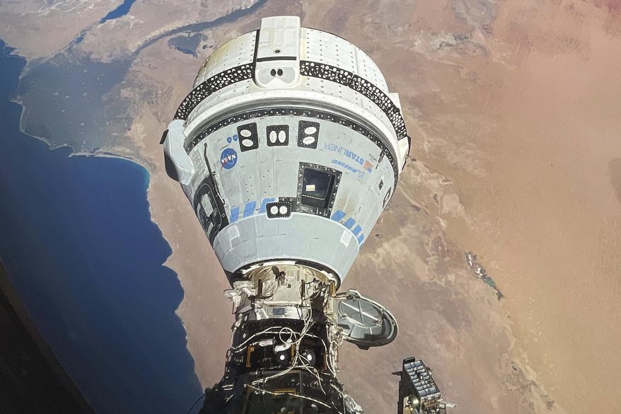 This photo provided by NASA shows the Starliner spacecraft docked to the Harmony module of the International Space Station, orbiting 262 miles above Egypt's Mediterranean coast, on June 13, 2024. (NASA via AP, File)
