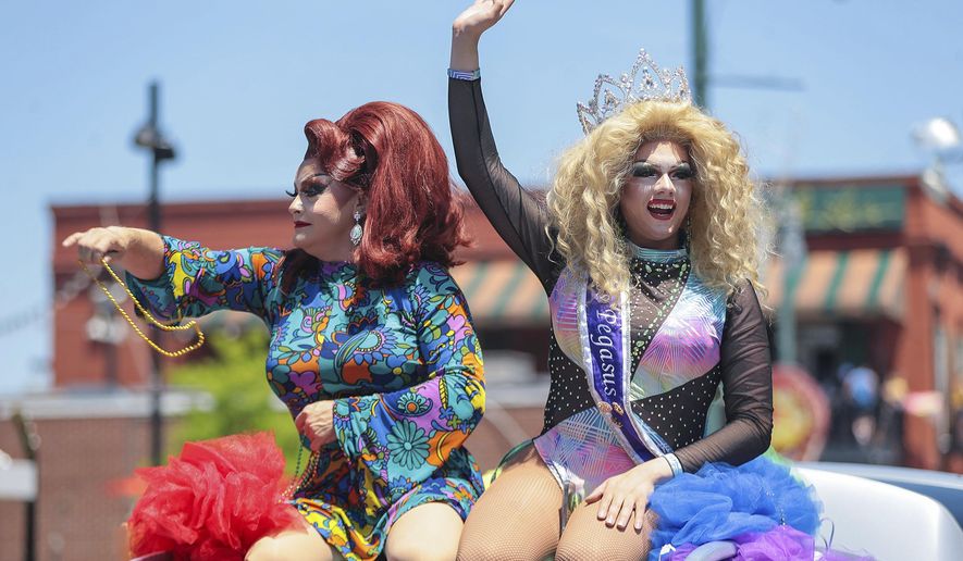 Pageant winners throw out beads during the Memphis PRIDE Festival & Parade, June 4, 2022, in Memphis, Tenn. A federal appeals court on Thursday, July 18, 2024, ordered the dismissal of a lawsuit challenging Tennessee's first-in-the-nation law designed to place strict limits on drag shows, reversing a lower court ruling that deemed the statute unconstitutional. (Patrick Lantrip/Daily Memphian via AP, File)