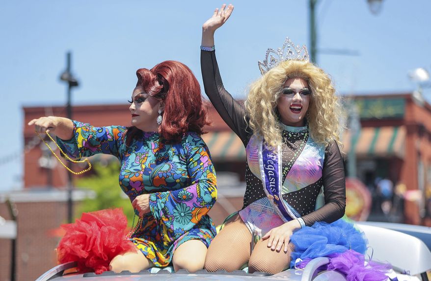 Pageant winners throw out beads during the Memphis PRIDE Festival & Parade, June 4, 2022, in Memphis, Tenn. A federal appeals court on Thursday, July 18, 2024, ordered the dismissal of a lawsuit challenging Tennessee's first-in-the-nation law designed to place strict limits on drag shows, reversing a lower court ruling that deemed the statute unconstitutional. (Patrick Lantrip/Daily Memphian via AP, File)
