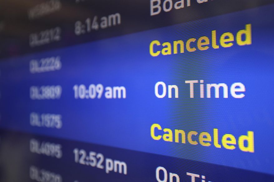 Flight boards show delayed or canceled flights at Minneapolis/St. Paul International airport after software issues delayed flights globally, Friday, July 19, 2024, in Minneapolis. (AP Photo/Adam Bettcher)