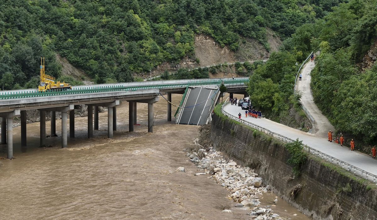 NextImg:11 dead and others missing after a highway bridge in China crumbles in flooding from heavy storms