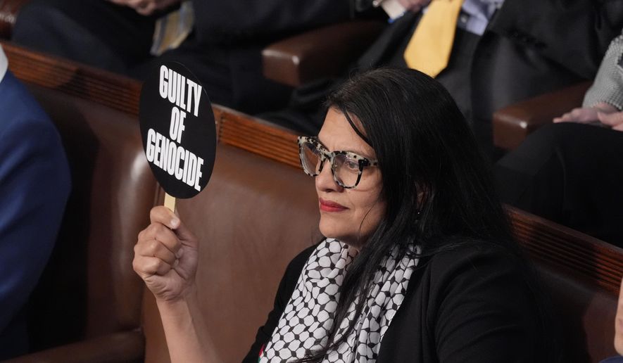 Rep. Rashida Tlaib, D-Mich., holds a sign as she attends a speech by Israeli Prime Minister Benjamin Netanyahu to a joint meeting of Congress at the U.S. Capitol in Washington, Wednesday, July 24, 2024. (AP Photo/J. Scott Applewhite) ** FILE **
