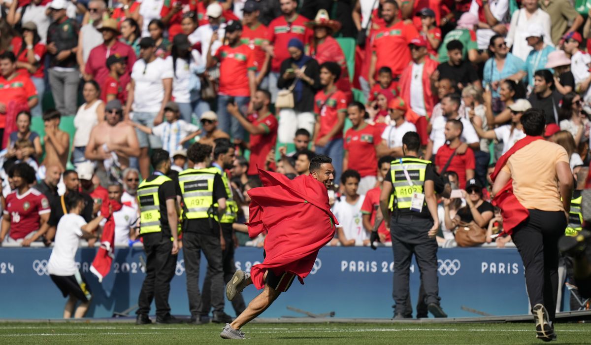 NextImg:Olympic soccer off to violent, chaotic start as Morocco fans rush field against Argentina
