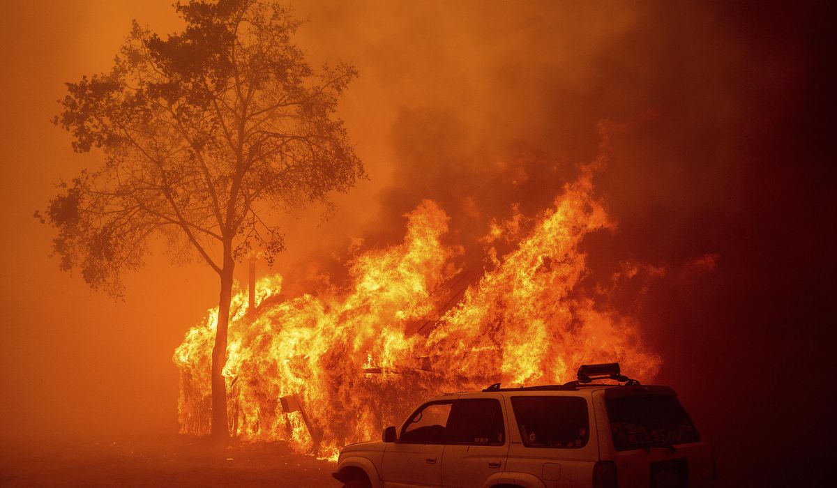 NextImg:Lightning and a burning car pushed into a gully are blamed for wildfires scorching the West