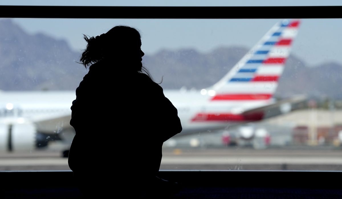 NextImg:Passengers evacuated after American Airlines plane catches fire at Denver airport