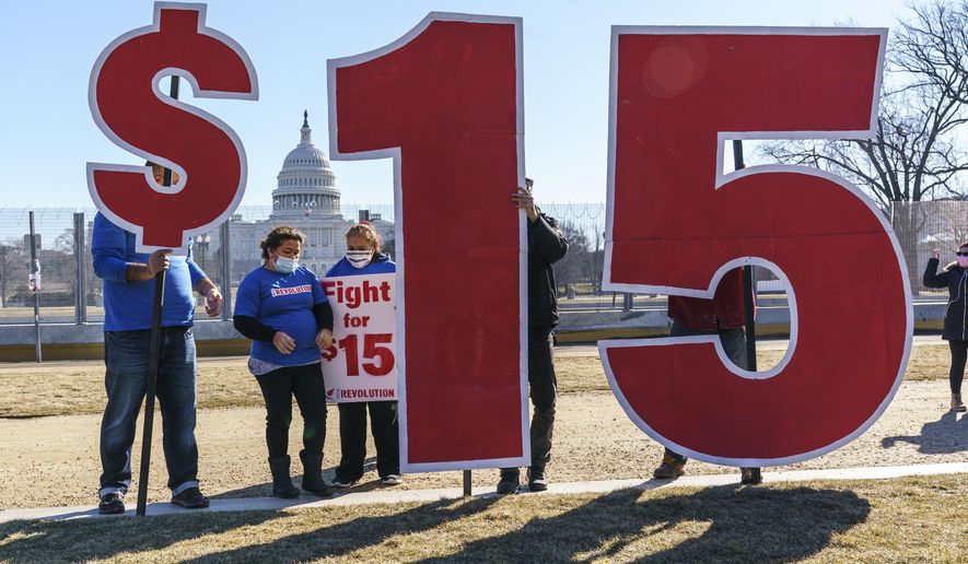 Activists appeal for a $15 minimum wage near the Capitol in Washington on Feb. 25, 2021. (AP Photo/J. Scott Applewhite) **FILE**