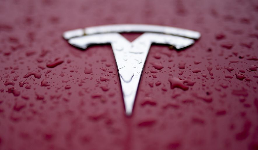 FILE - A Tesla logo is shown on Feb. 27, 2024, in Charlotte, N.C. Authorities in Washington announced Tuesday, July 30 that the Tesla that hit and killed a motorcyclist near Seattle in April was operating on the company’s “Full Self Driving” system. (AP Photo/Chris Carlson, File)