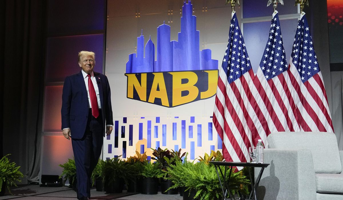 NextImg:Donald Trump falsely questions Kamala Harris’ race as he appears at gathering of Black journalists
