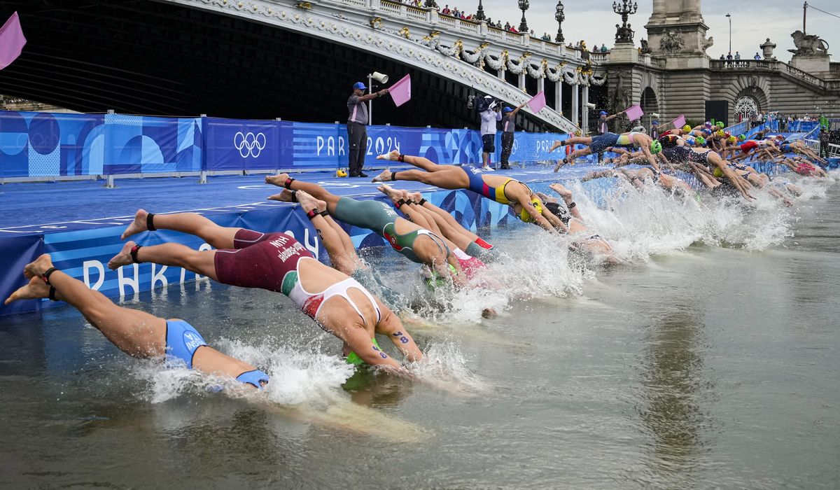 NextImg:Olympic triathletes swim in Seine River after days of concerns about water quality