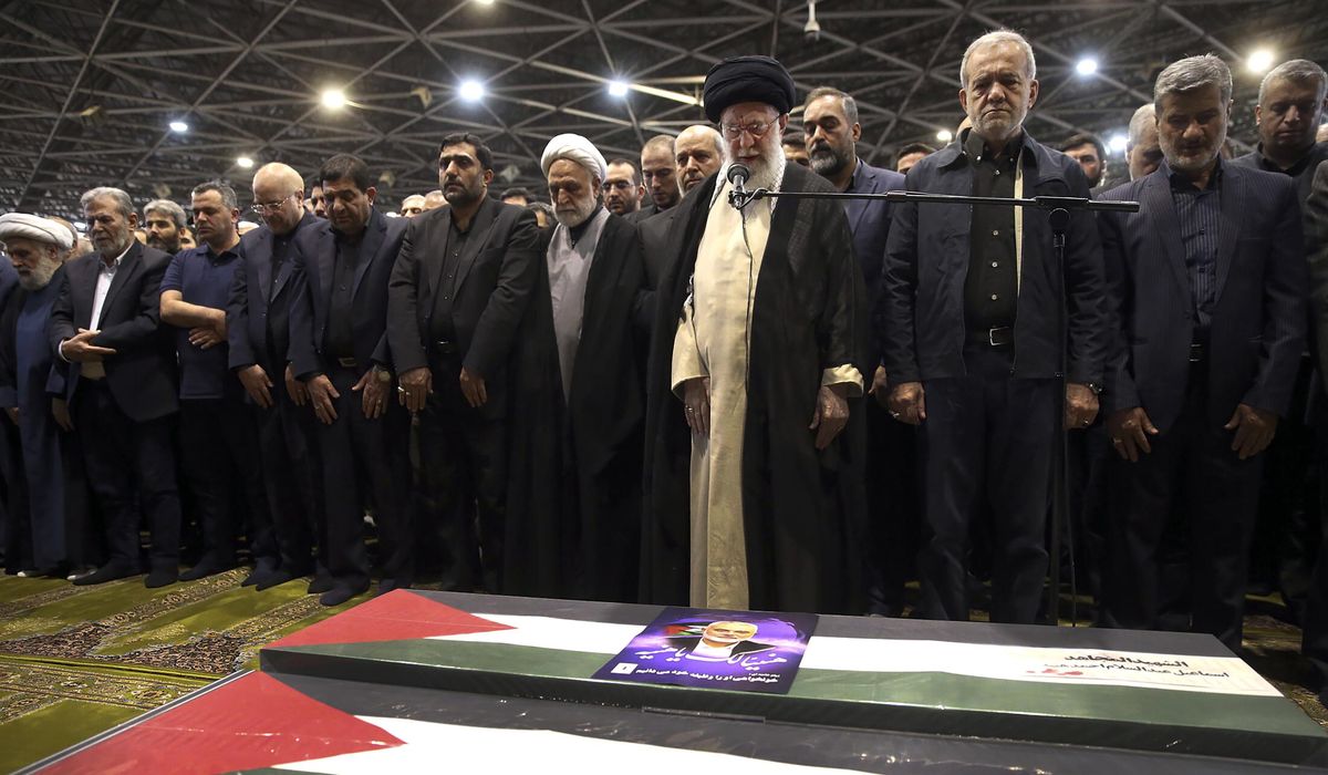 NextImg:Iran’s supreme leader prays over the coffin of Hamas leader Haniyeh, whose killing risks a wider war