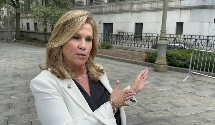 Terry Strada, national chair of 9/11 Families United, speaks outside Manhattan federal court on Wednesday, July 31, 2024, shortly after plea deals were announced for three men charged in the Sept. 11 attacks. (AP Photo/Lawrence Neumeister)