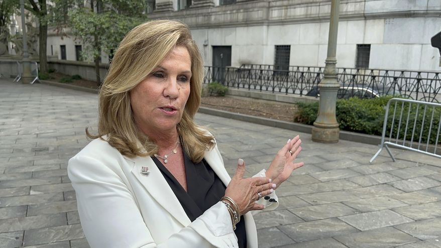 Terry Strada, national chair of 9/11 Families United, speaks outside Manhattan federal court on Wednesday, July 31, 2024, shortly after plea deals were announced for three men charged in the Sept. 11 attacks. (AP Photo/Lawrence Neumeister)