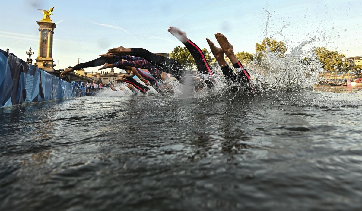 NextImg:Seine reopened to Parisian swimmers, then closed after a day by rain