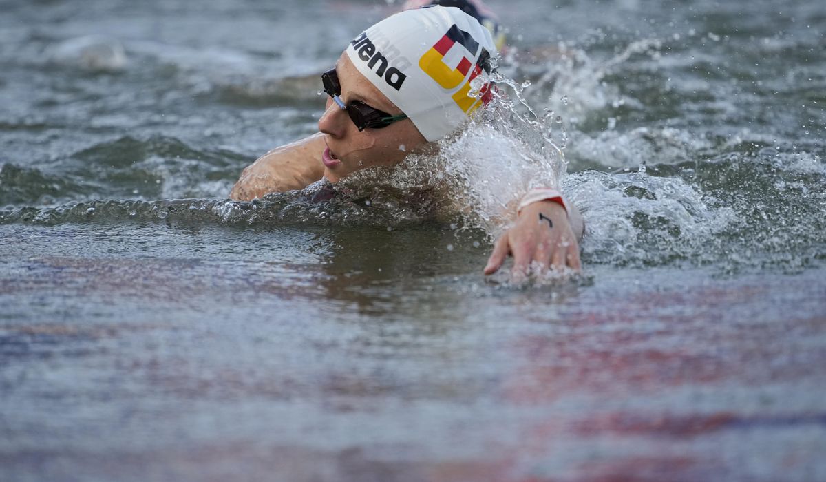 NextImg:German open water athlete falls ill after swimming in the Seine River