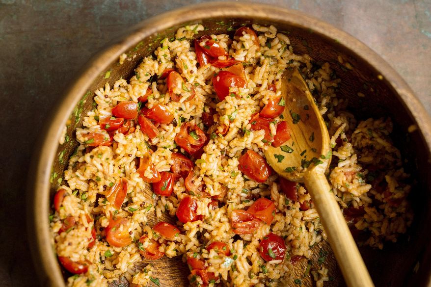 This image released by Milk Street shows a recipe for Indian tomato rice. (Milk Street via AP)