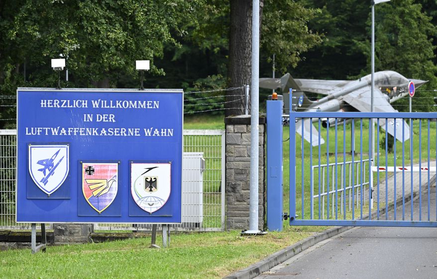 A sign at the entrance to the air force barracks in Wahn outside Cologne, Germany, Wednesday Aug. 14, 2024. Investigators are looking into suspicions of unauthorized entry and possible sabotage at a major military barracks in western Germany. (Roberto Pfeil/dpa via AP)
